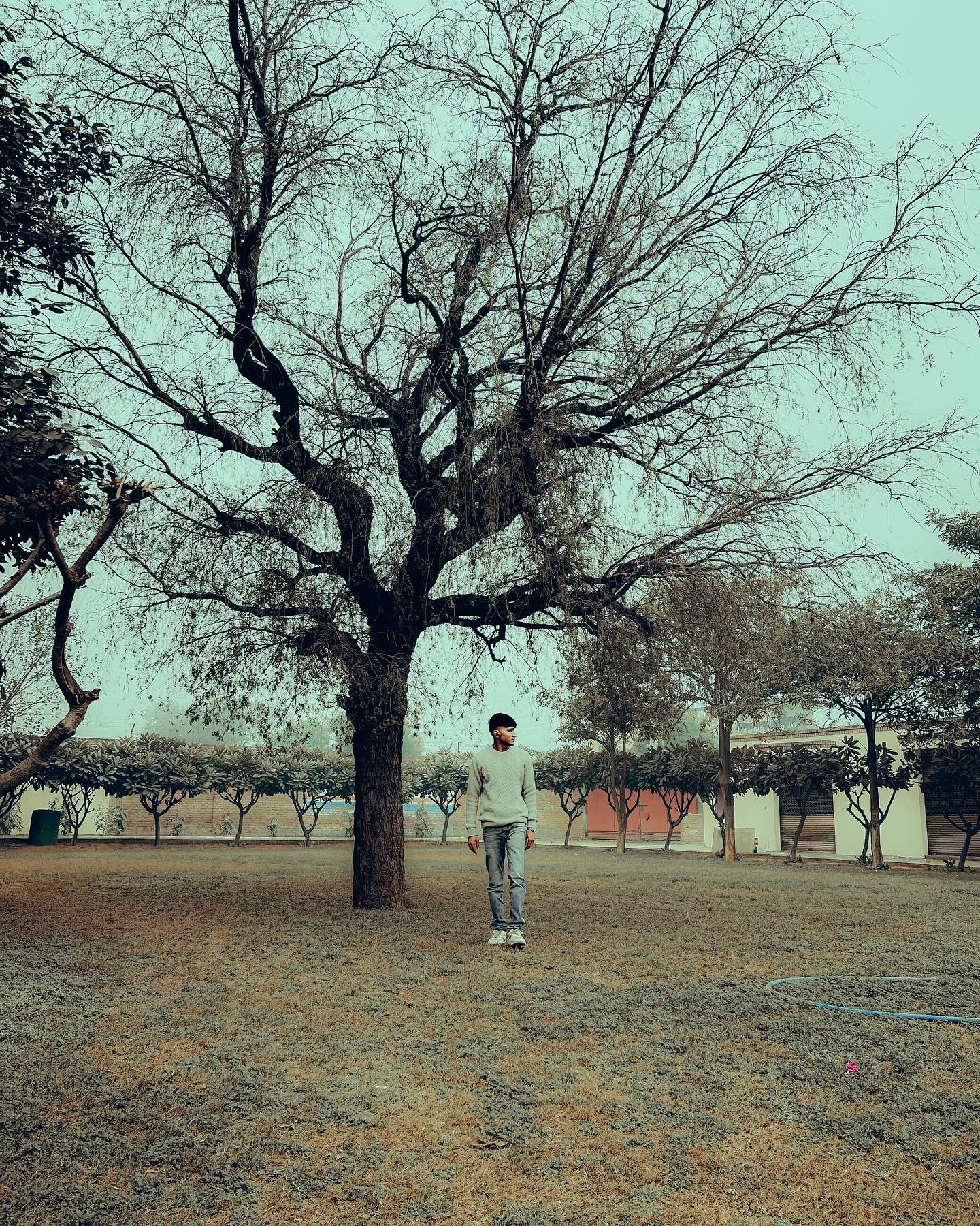Pradeep Kumar standing for a portrait
